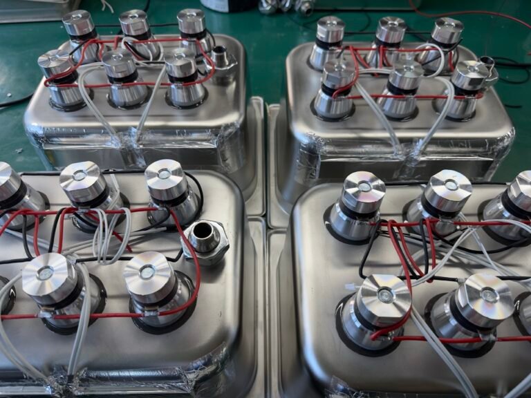 Powerful ultrasonic transducers installed on commercial ultrasonic cleaner tanks