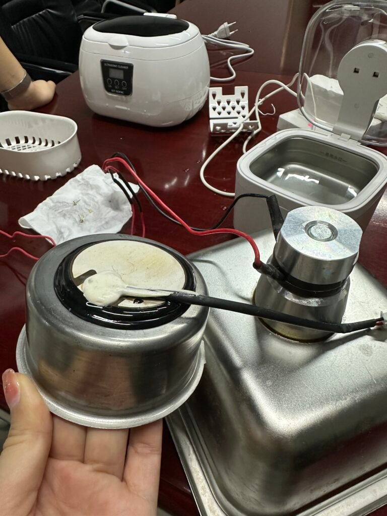 Comparison of a ceramic disc in a household ultrasonic cleaner and a metal transducer in a commercial ultrasonic cleaner