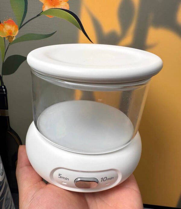 Portable ultrasonic retainer cleaner with open lid and transparent glass tank